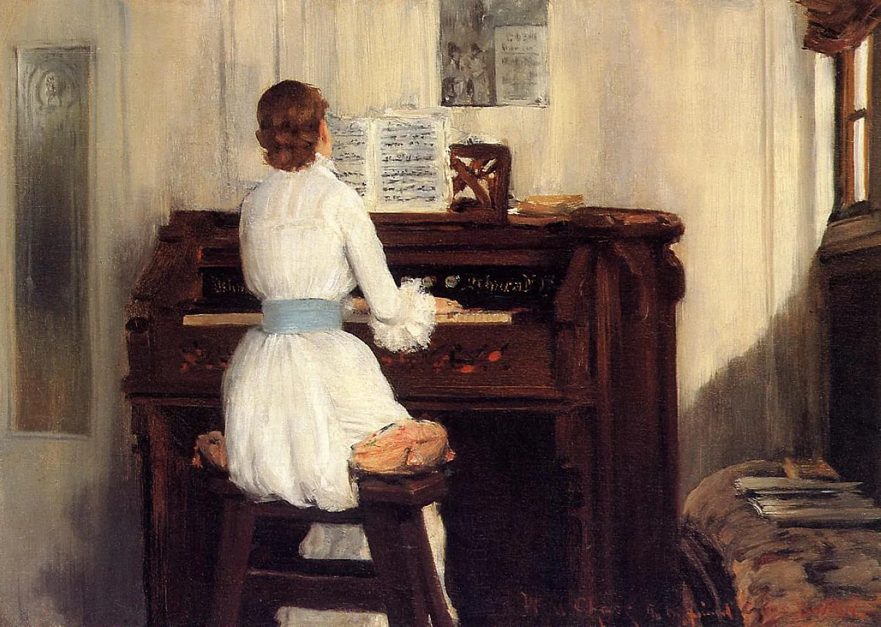 Woman playing an upright piano