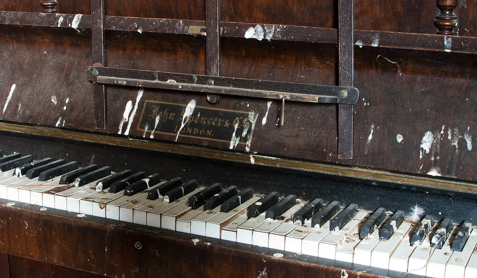 Old upright piano with damaged keys Old upright piano with damaged keys