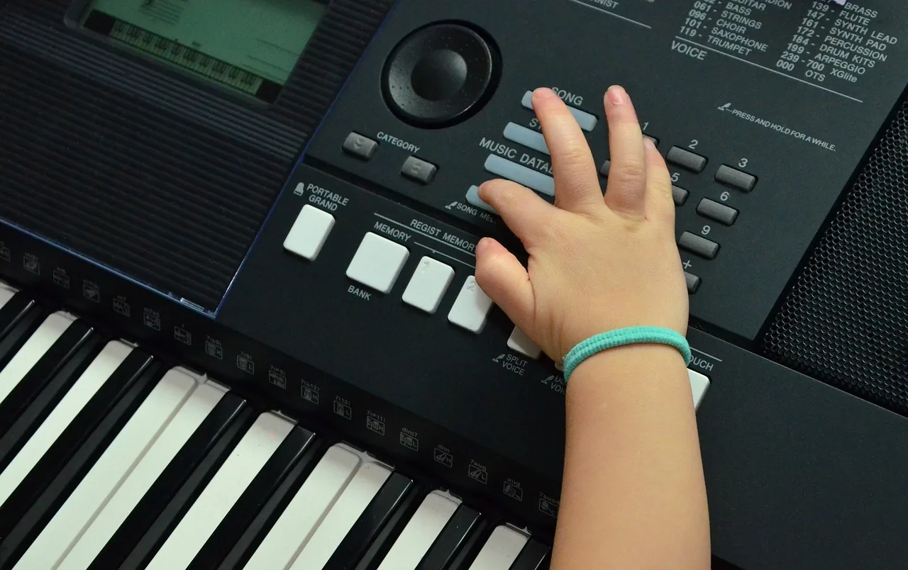 Hand on a digital piano