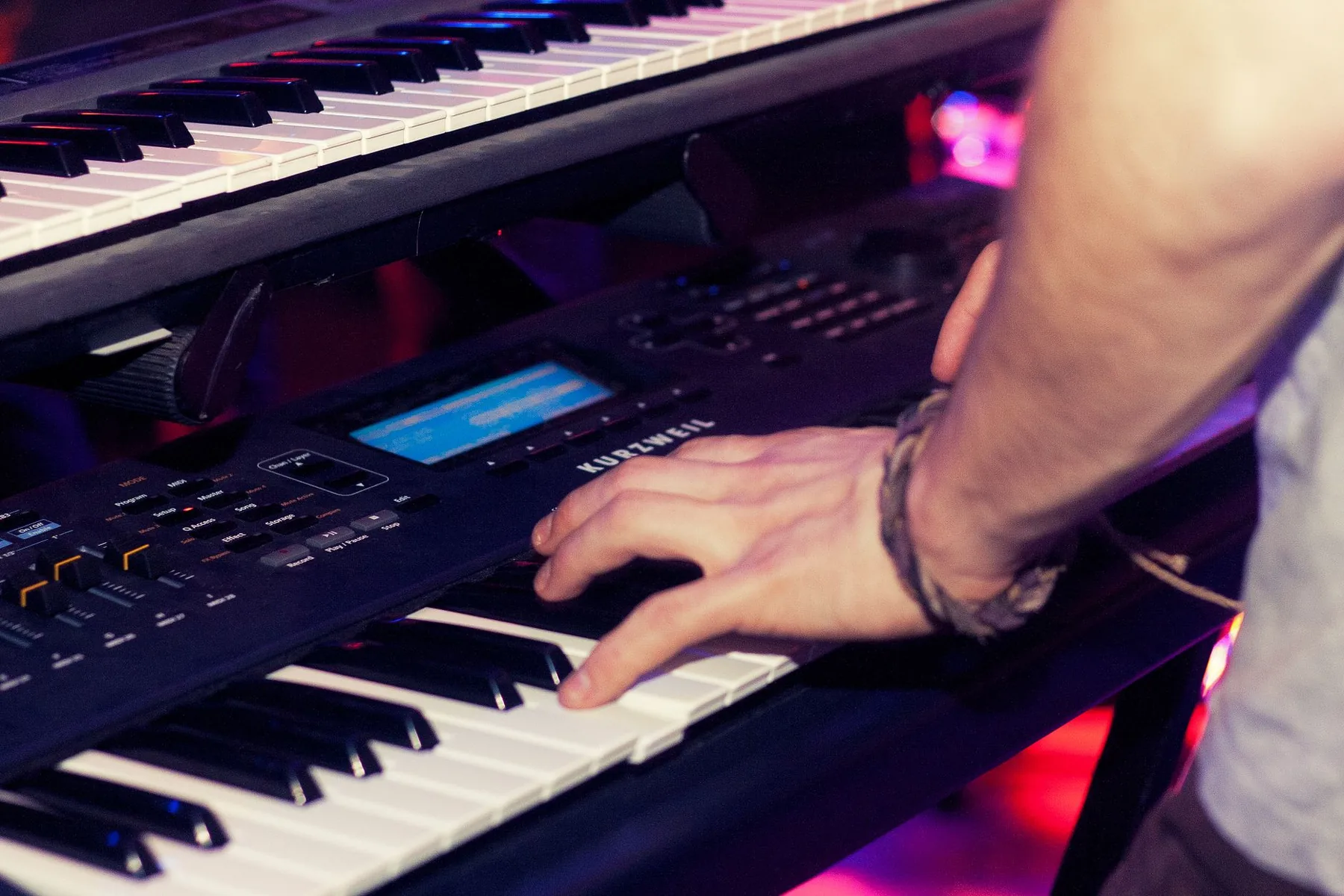 Hands playing scales on a keyboard Hands playing scales on a keyboard