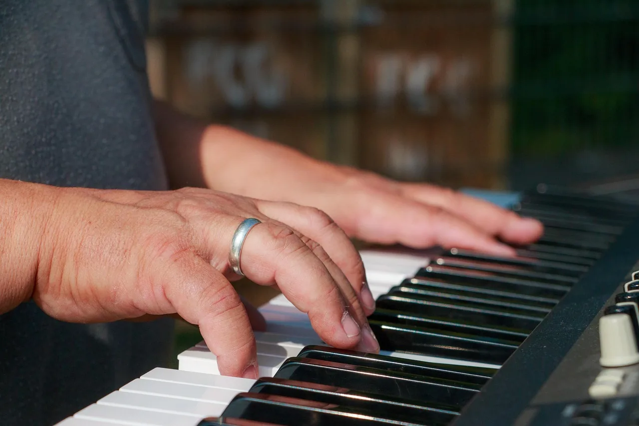 Musician playing a synthesizer