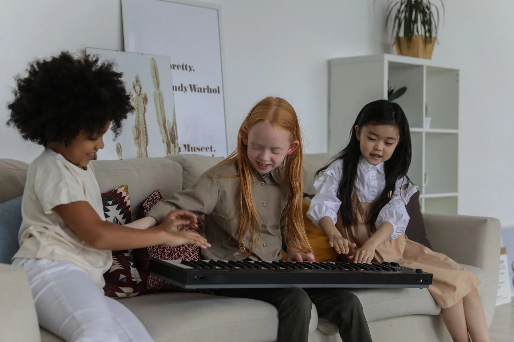 Children discovering an electronic synthesizer Children discovering an electronic synthesizer