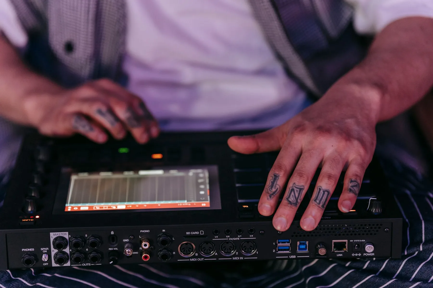 Musician using a digital synthesizer