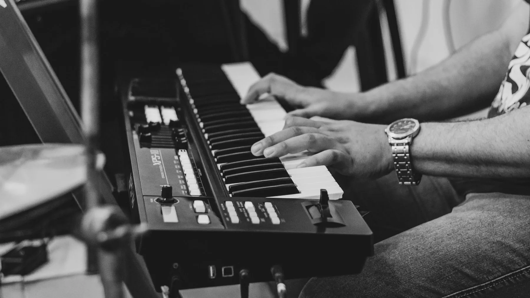 Musician playing an electronic synthesizer